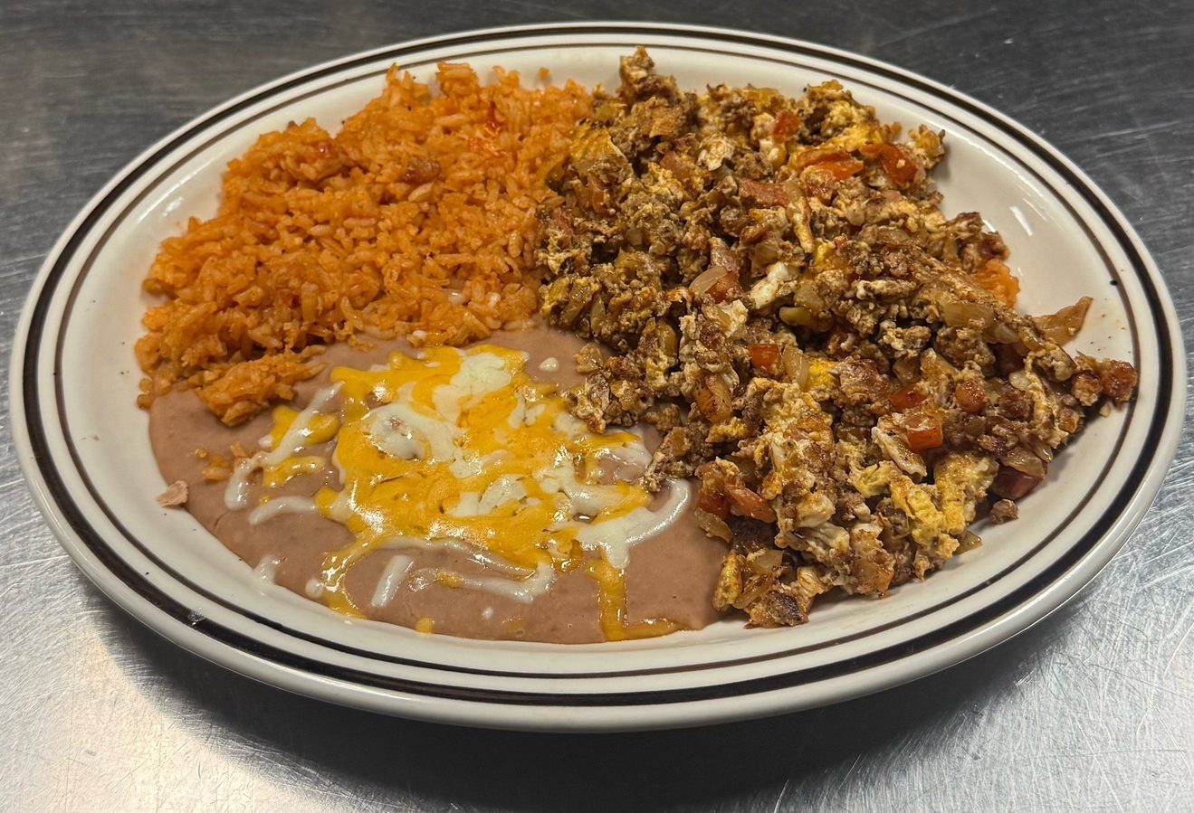 # 13 Chorizo Con Huevos.