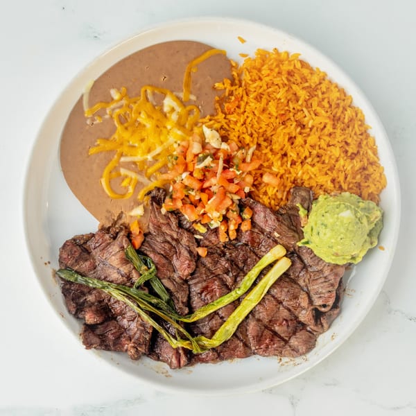 Juan Colorado's carne asada plate with refried beans, rice, pico de gallo, and guacamole.