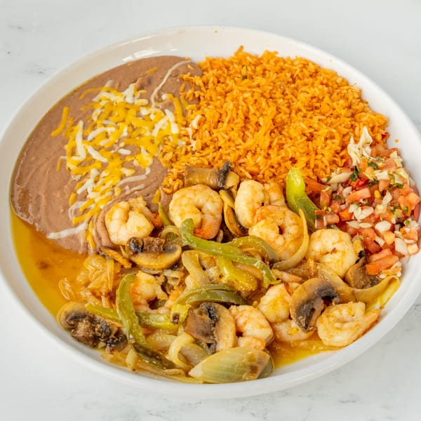 Shrimp with sautéed vegetables, rice, refried beans with cheese, and pico de gallo.