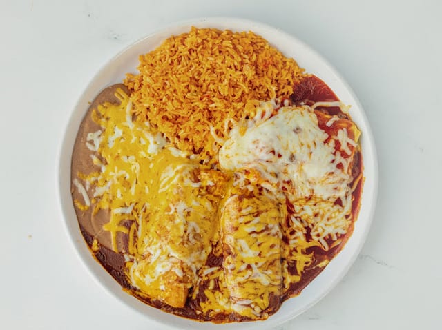 #23 1 Enchiladas, 1 Tamale (Pork) and 1 Chile Relleno (Cheese).