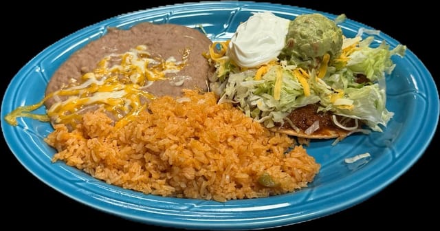 #49 Deluxe Tostada with Guacamole and Sour Cream.
